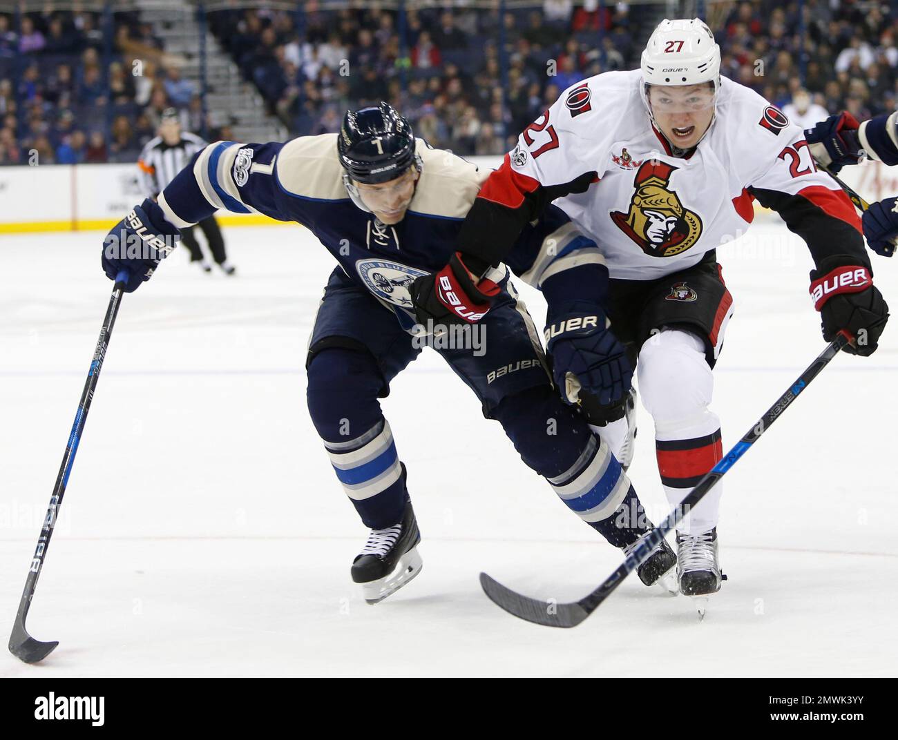 Columbus Blue Jackets' Jack Johnson, left, and Ottawa Senators' Curtis