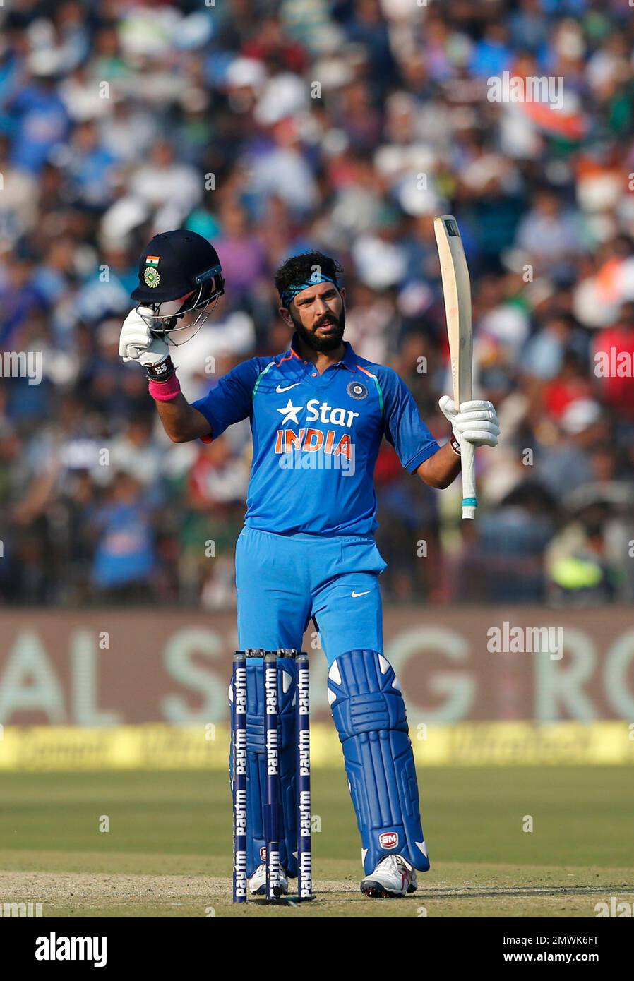 India's Yuvraj Singh raises his bat and helmet after completing his century in the third and final cricket test match between India and Pakistan in Karachi, February 1, 2006. Pakistan went on India's Yuvraj Singh raises his bat and helmet after completing his century in the third and final cricket test match between India and Pakistan in Karachi, February 1, 2006. Pakistan went on