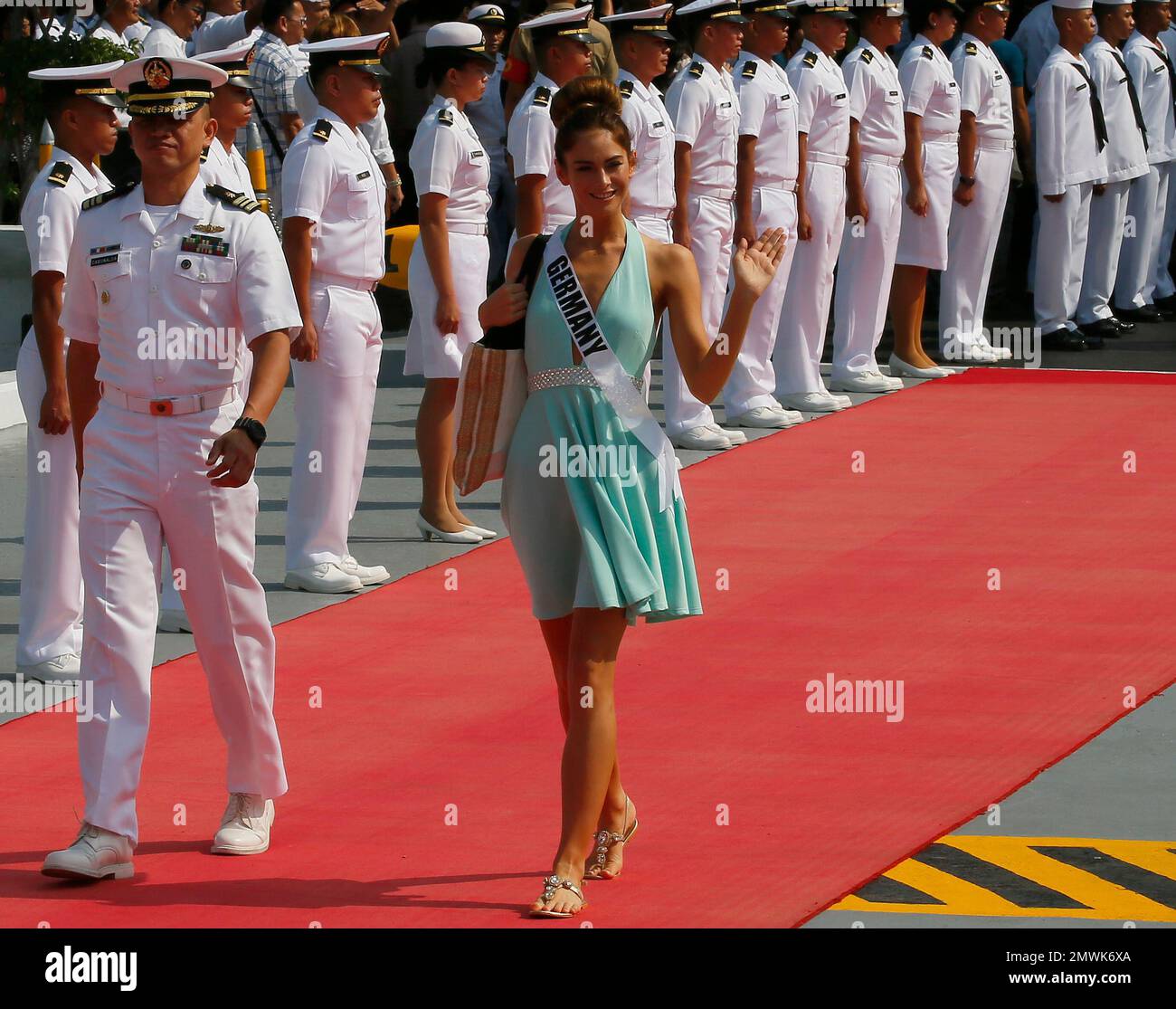 Miss Universe contestant Johanna Acs of Germany waves as she walks to ...