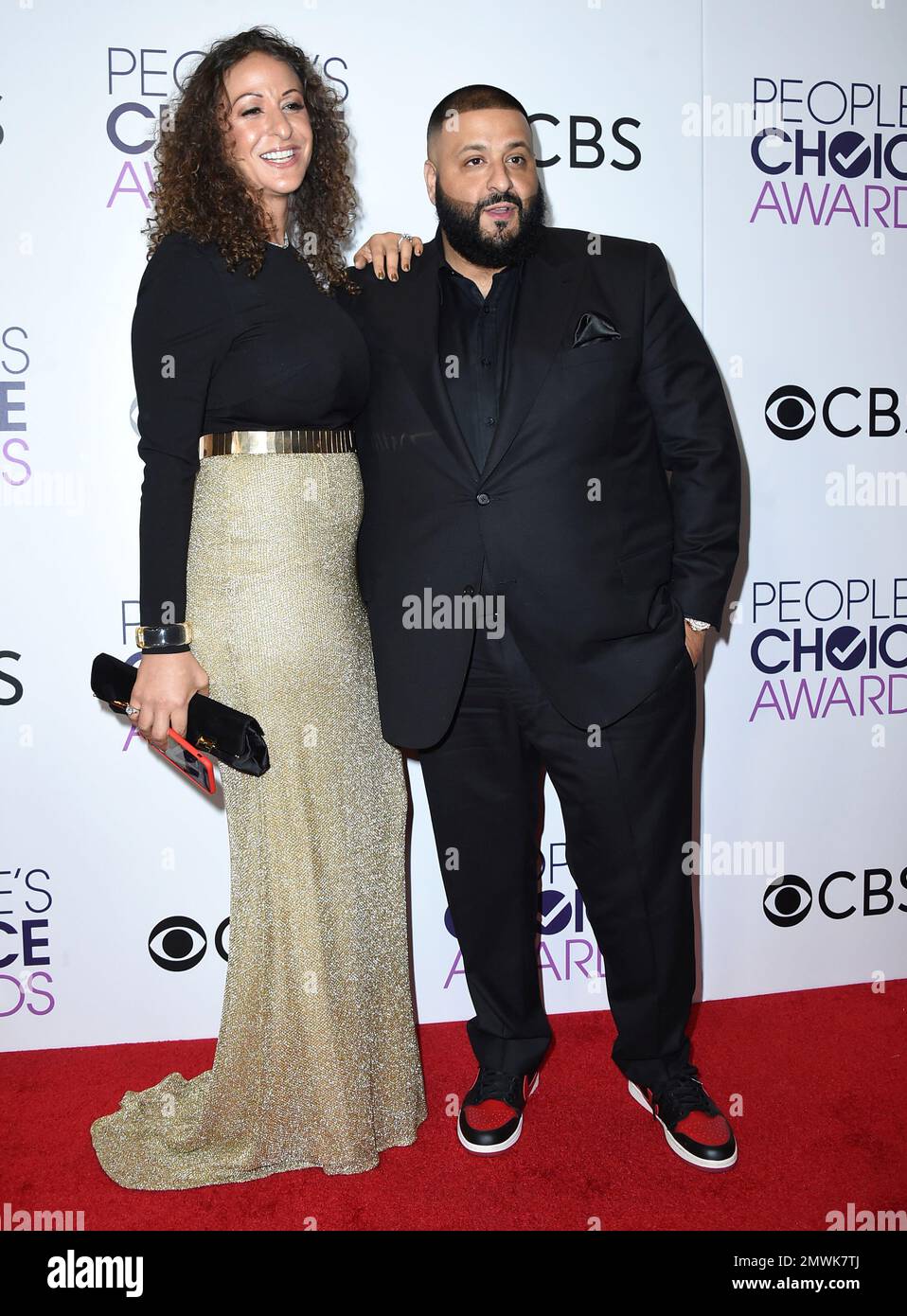 Nicole Tuck, left, and DJ Khaled pose in the press room at the People's