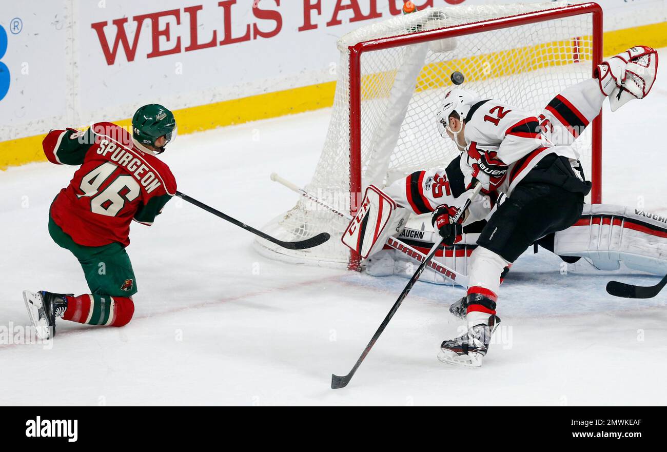 Minnesota Wild's Jared Spurgeon, left, scores a powerplay goal against