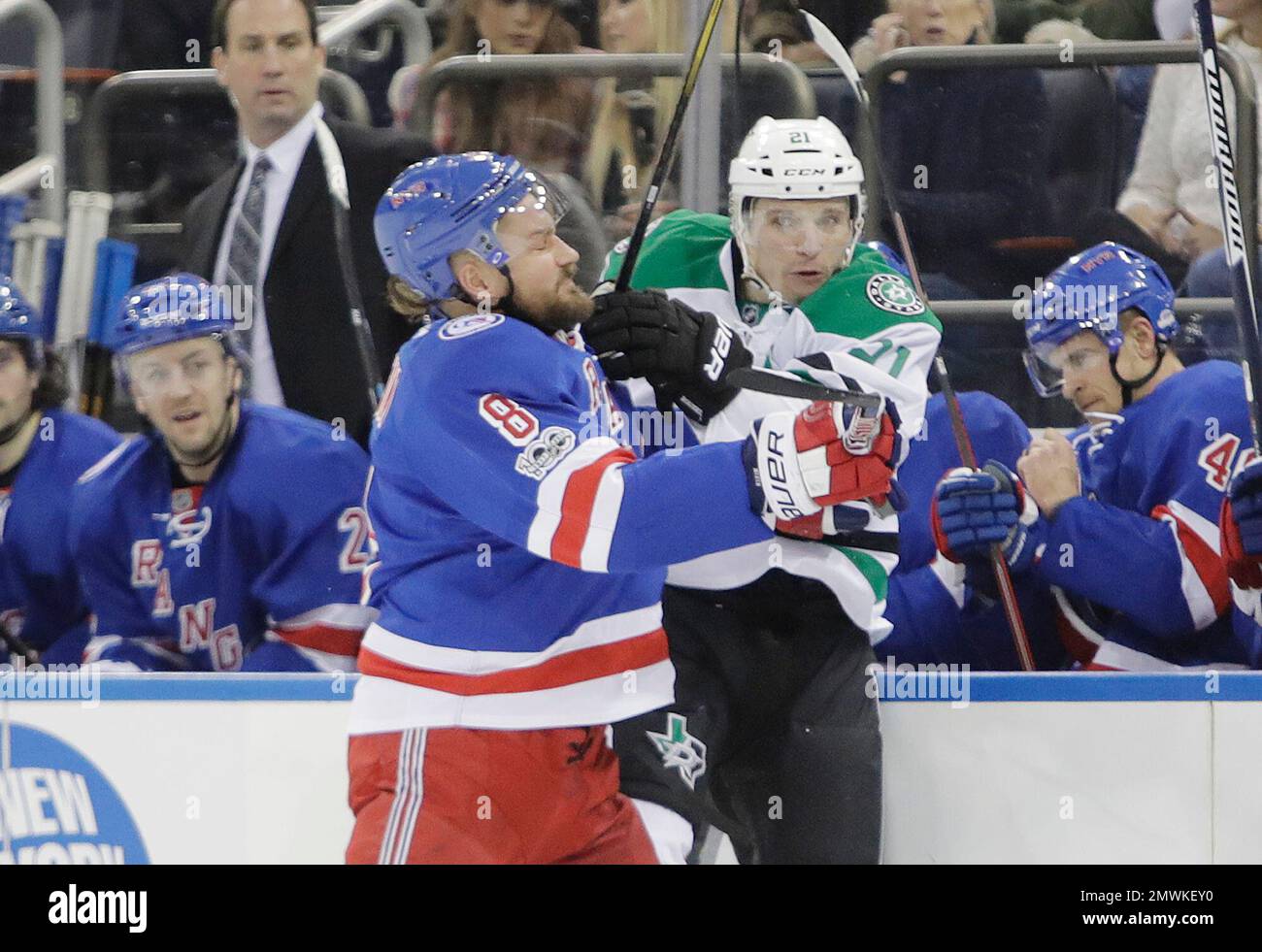 New York Rangers' Kevin Klein (8) checks Dallas Stars' Antoine Roussel ...