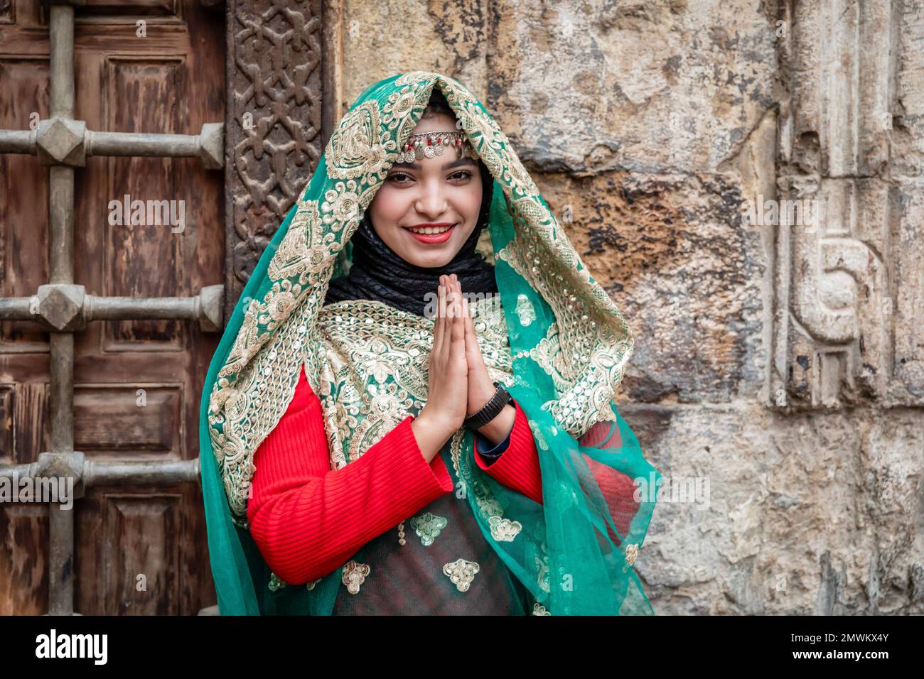 Egyptian girl in traditional dress at El-Moez Street and Khan Khalili Bazaar, Old Cairo, Egypt Stock Photo