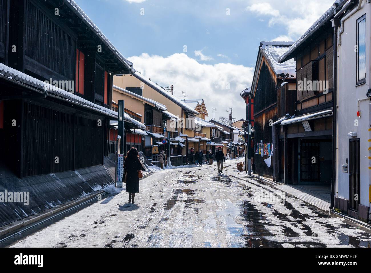 Kyoto, Japan - January 24 2023 : Hanamikoji Street with snow in winter. Gion District. Stock Photo