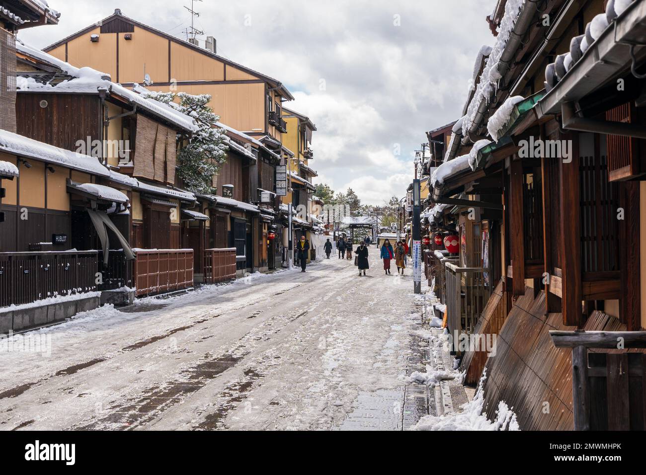 Kyoto, Japan - January 24 2023 : Hanamikoji Street with snow in winter. Gion District. Stock Photo