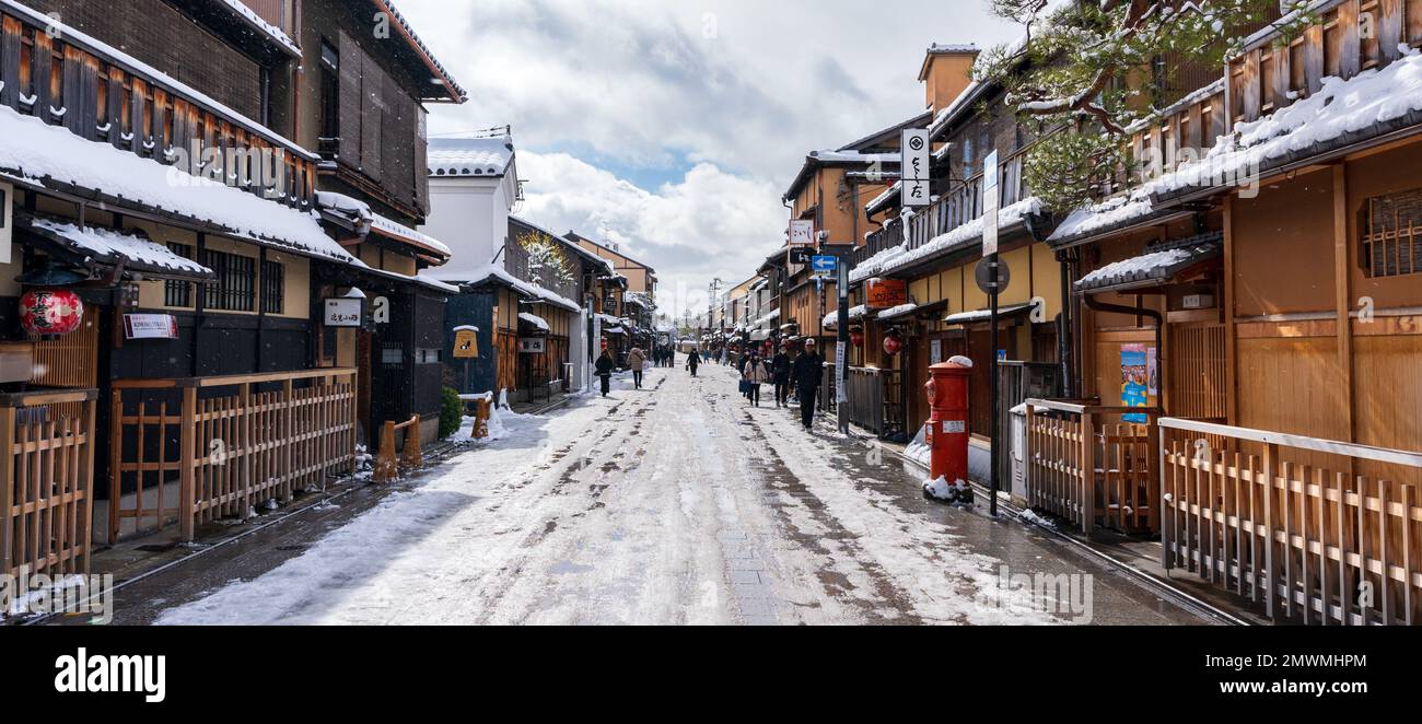 Kyoto, Japan - January 24 2023 : Hanamikoji Street with snow in winter. Gion District. Stock Photo