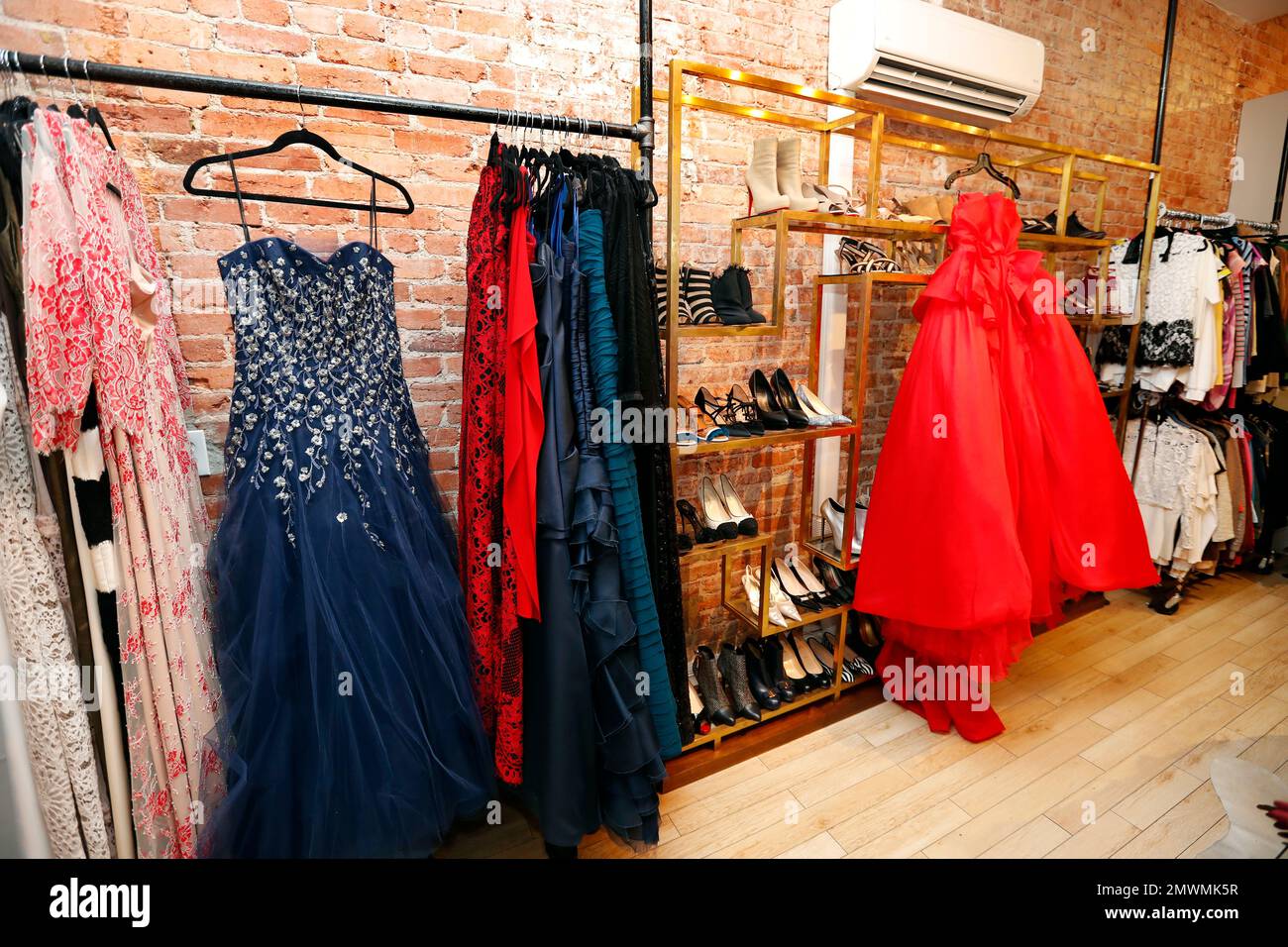 Designer dresses are for sale at Ella-Rue, including the navy Liancarlo for  $1,315, and the red Moschino at right for $4,550, Monday, Jan. 9, 2017 in  the Georgetown area of Washington. Ladies