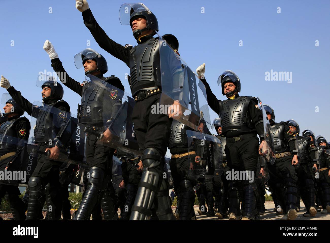 Iraqi riot police march during a ceremony marking Police Day in Basra ...