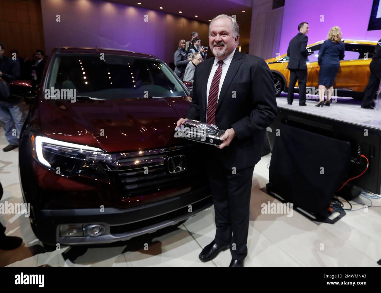President And CEO Of Honda North America John Mendel Stands Next To The 