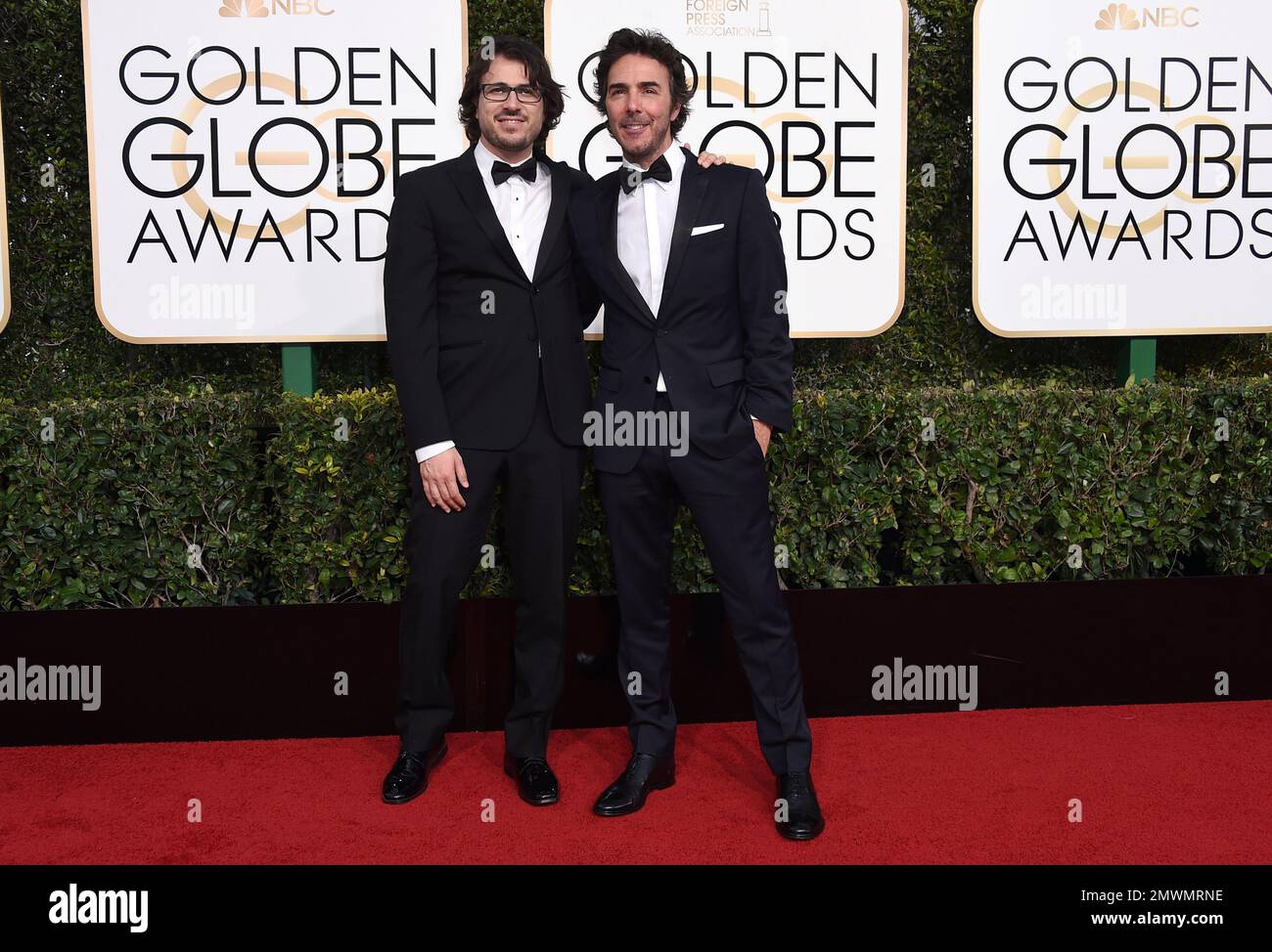 Dan Cohen, left, and Shawn Levy arrive at the 74th annual Golden Globe