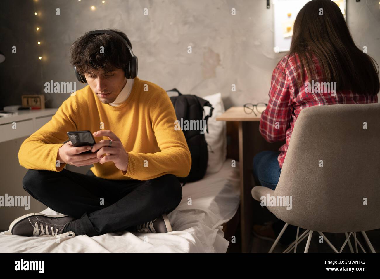 Serious college students studying in dormitory prepare for exams. Copy space Stock Photo