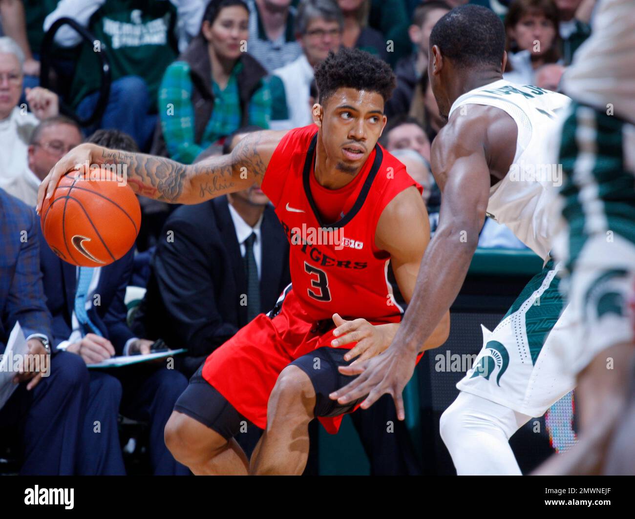 Rutgers' Corey Sanders (3) drives against Michigan State's Tum Tum