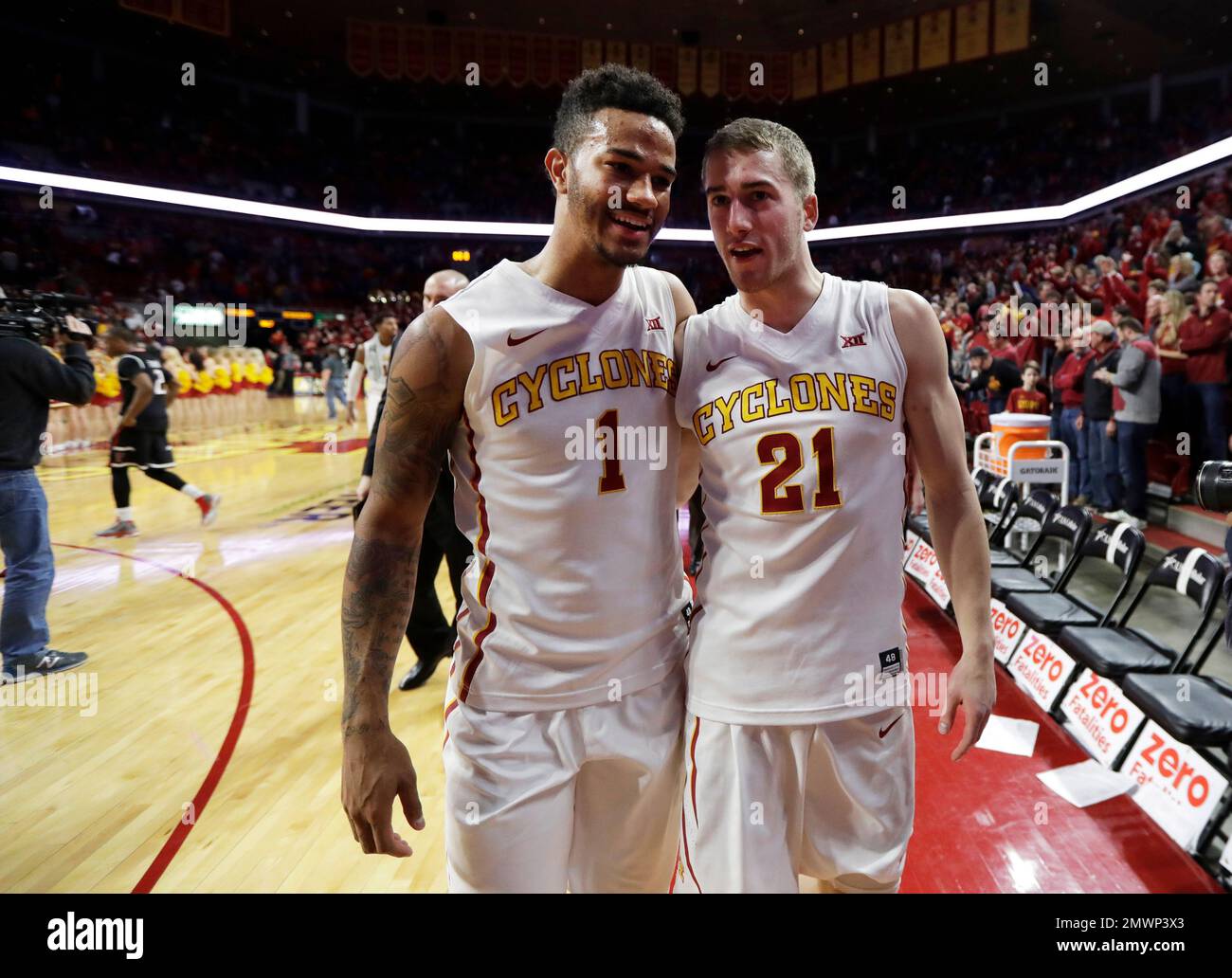Iowa State's Nick WeilerBabb, left, and Matt Thomas (21) walk off the