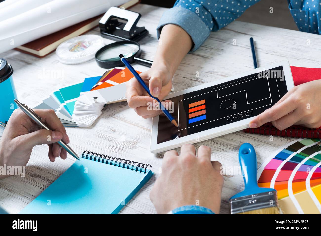 Web designer choosing colors from swatches Stock Photo - Alamy