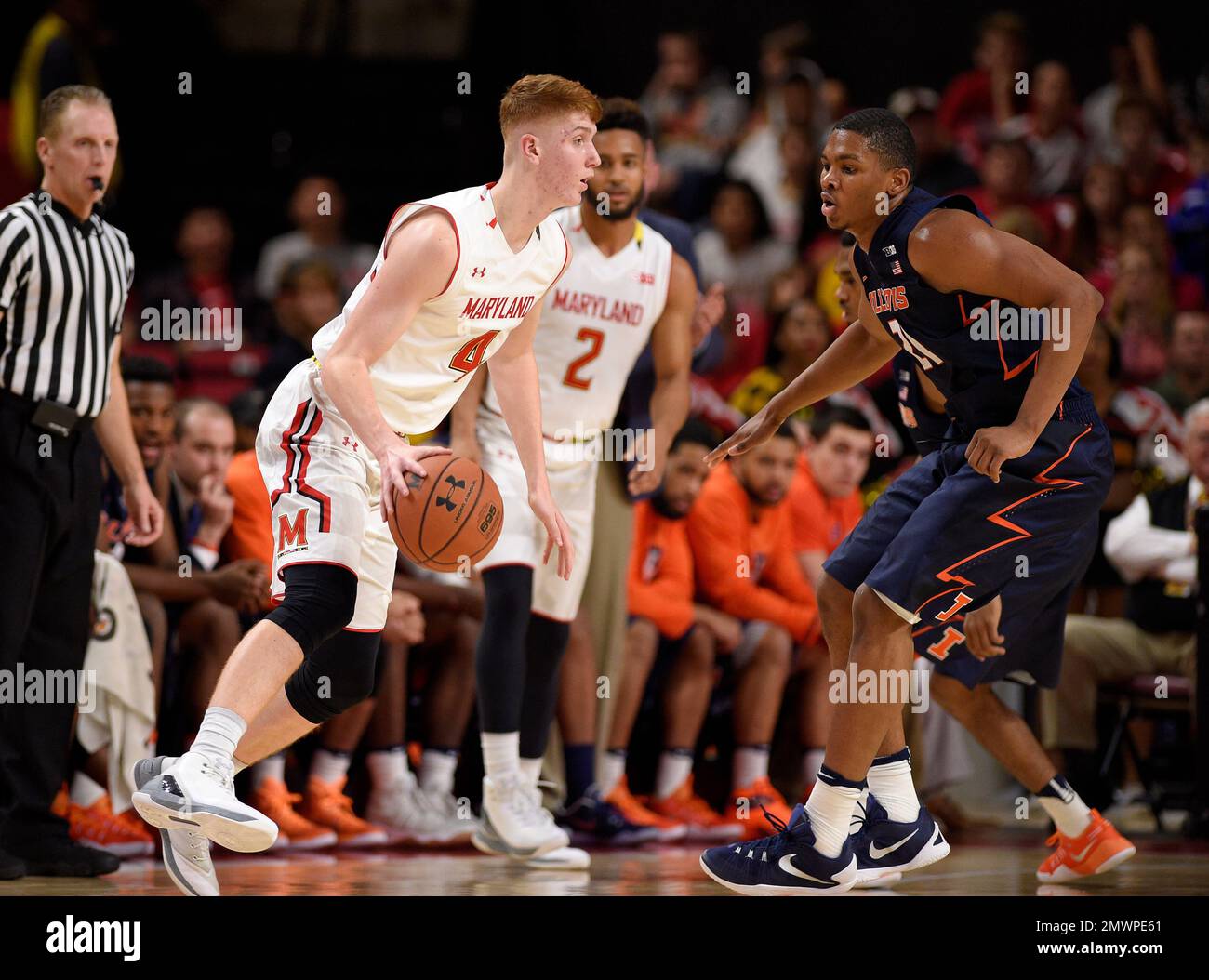 Maryland guard Kevin Huerter (4) dribbles against Illinois guard Malcolm Hill (21) during the
