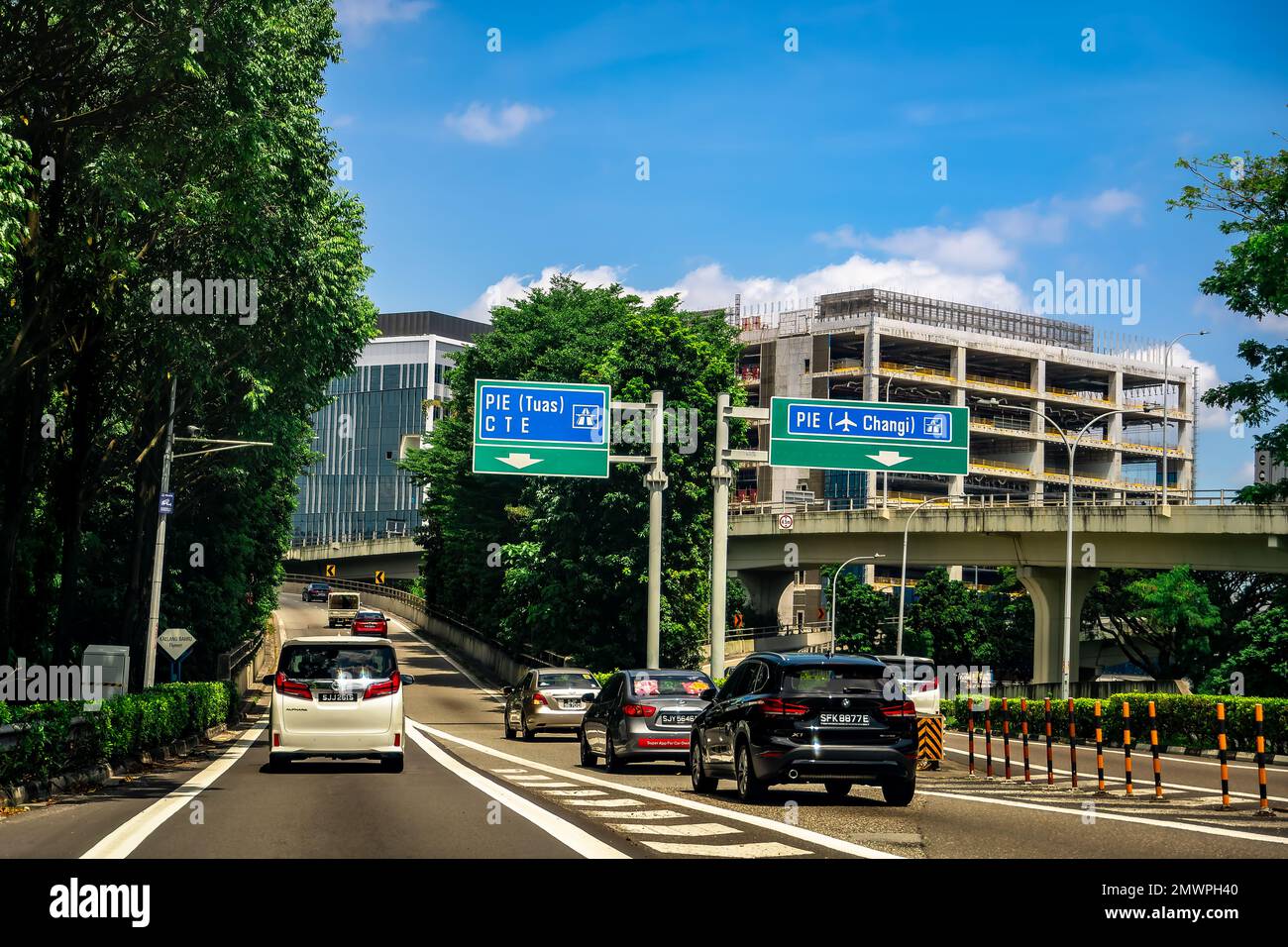 Cars merging into Pan Island Expressway (PIE), moving towards Tuas