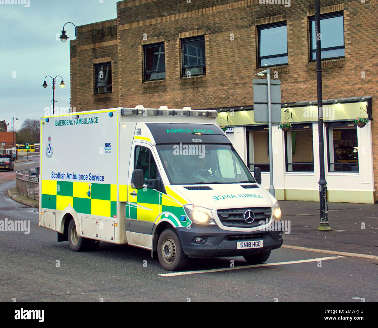 Ambulance rushing to emergency on killbowie road Clydebank Stock Photo