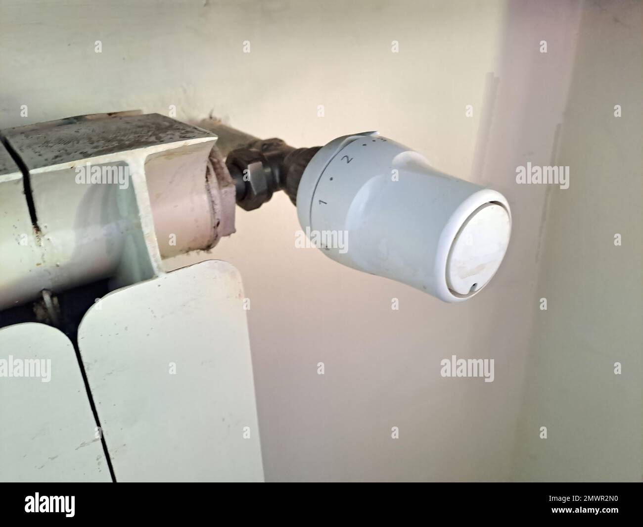 Hand adjustment of heating temperature on the radiator. Consumption of