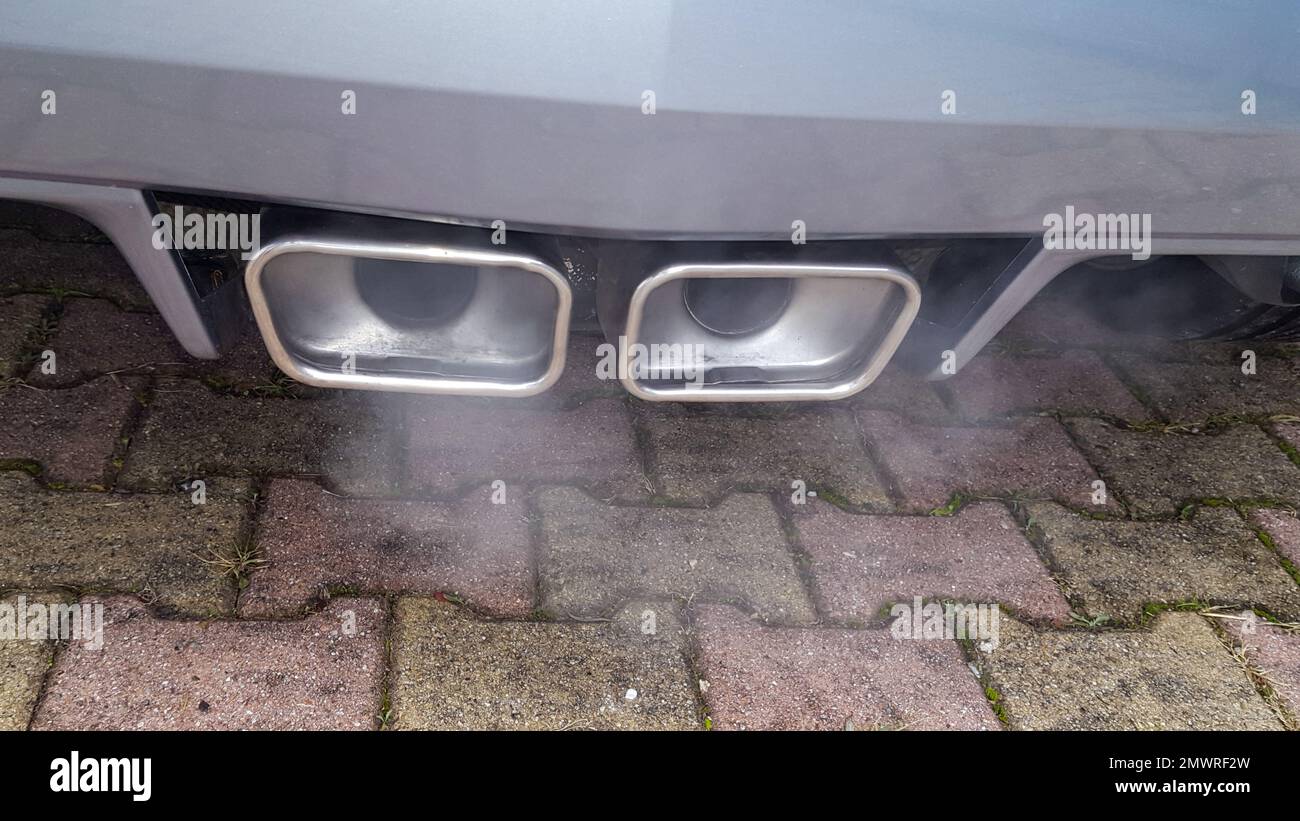 smoking sports car exhaust outlet Stock Photo Alamy