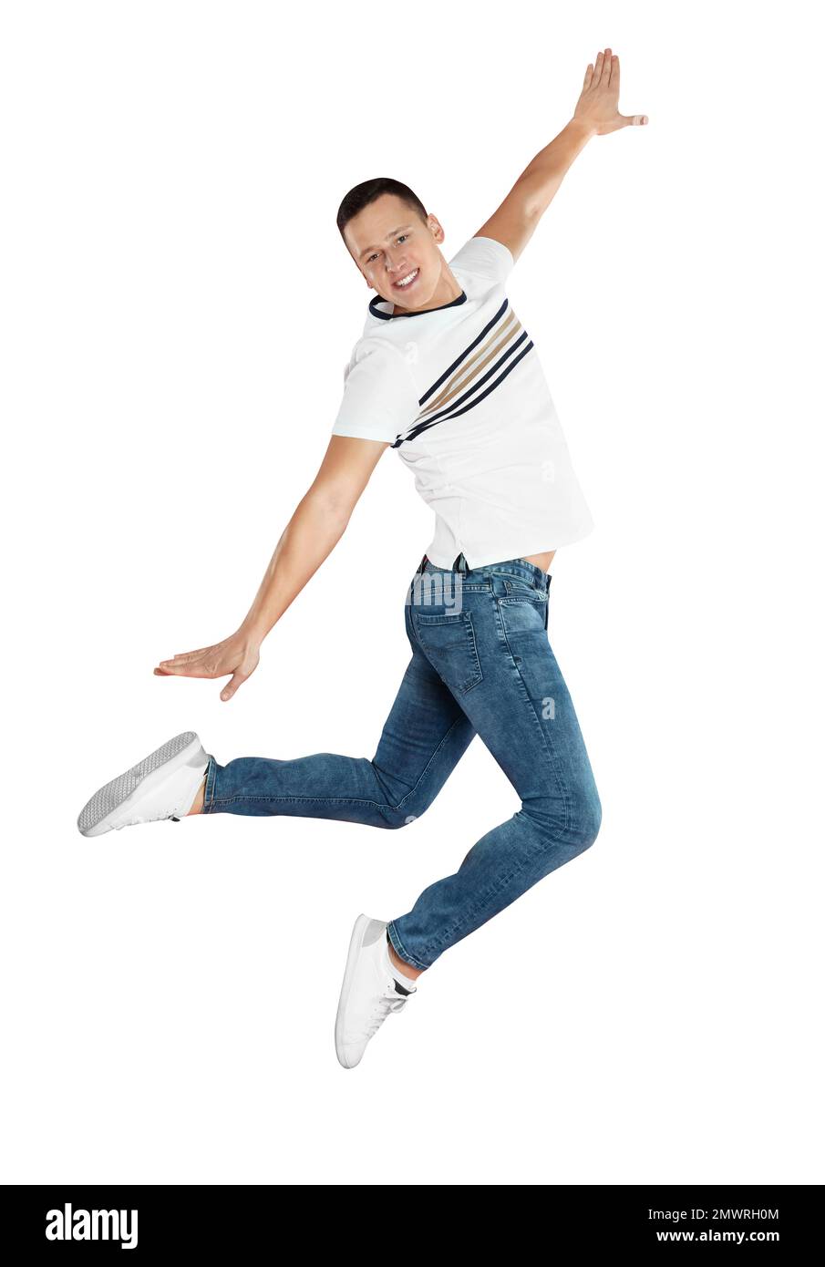 Handsome young man jumping on red background Stock Photo
