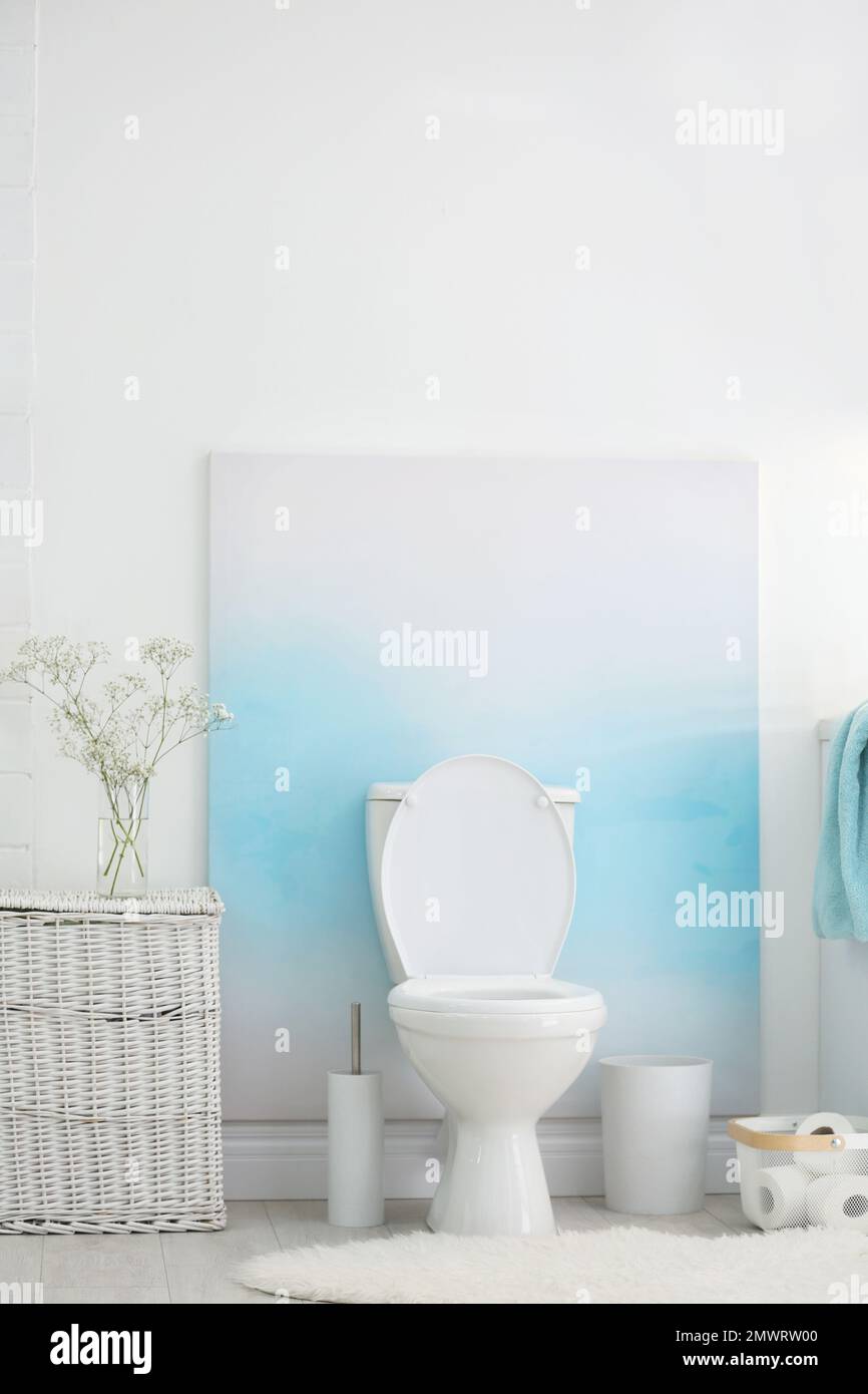 Modern toilet bowl in stylish bathroom interior Stock Photo - Alamy