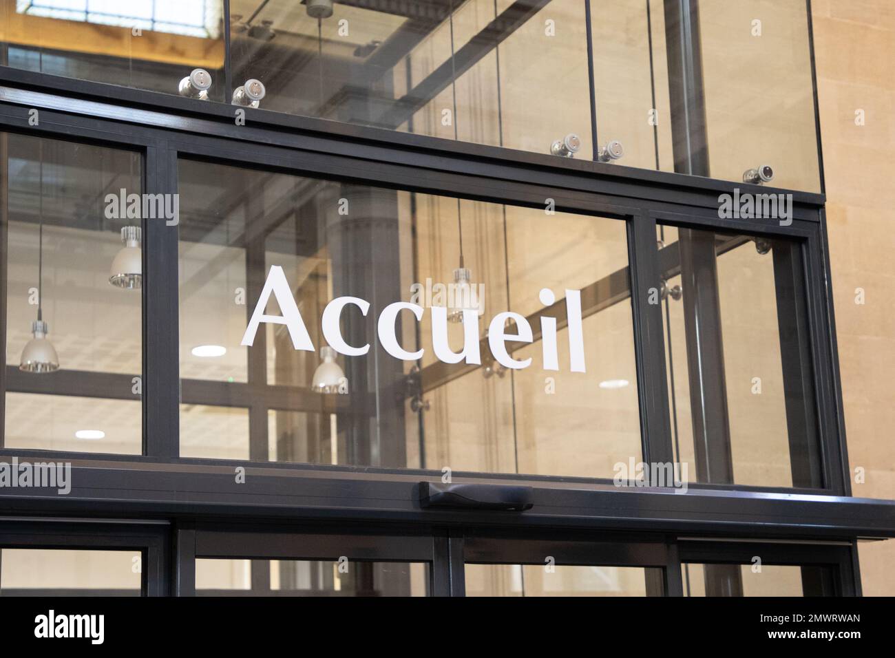 accueil in french text panel means entry reception on the office windows Stock Photo Alamy