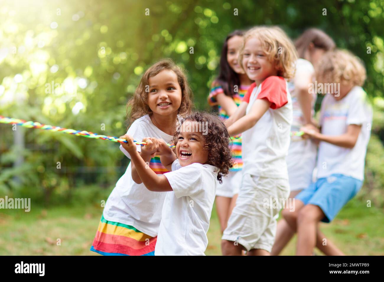 Two happy little asian kids playing outdoor in the sunny park Stock Photo -  Alamy