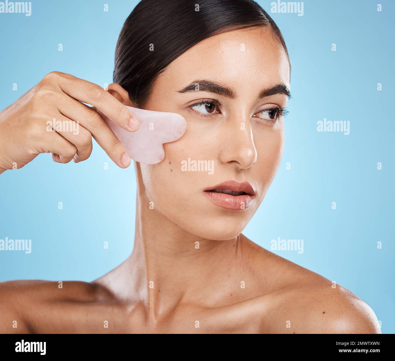 Skin care, face massage and beauty woman with gua sha for dermatology, cosmetics and wellness