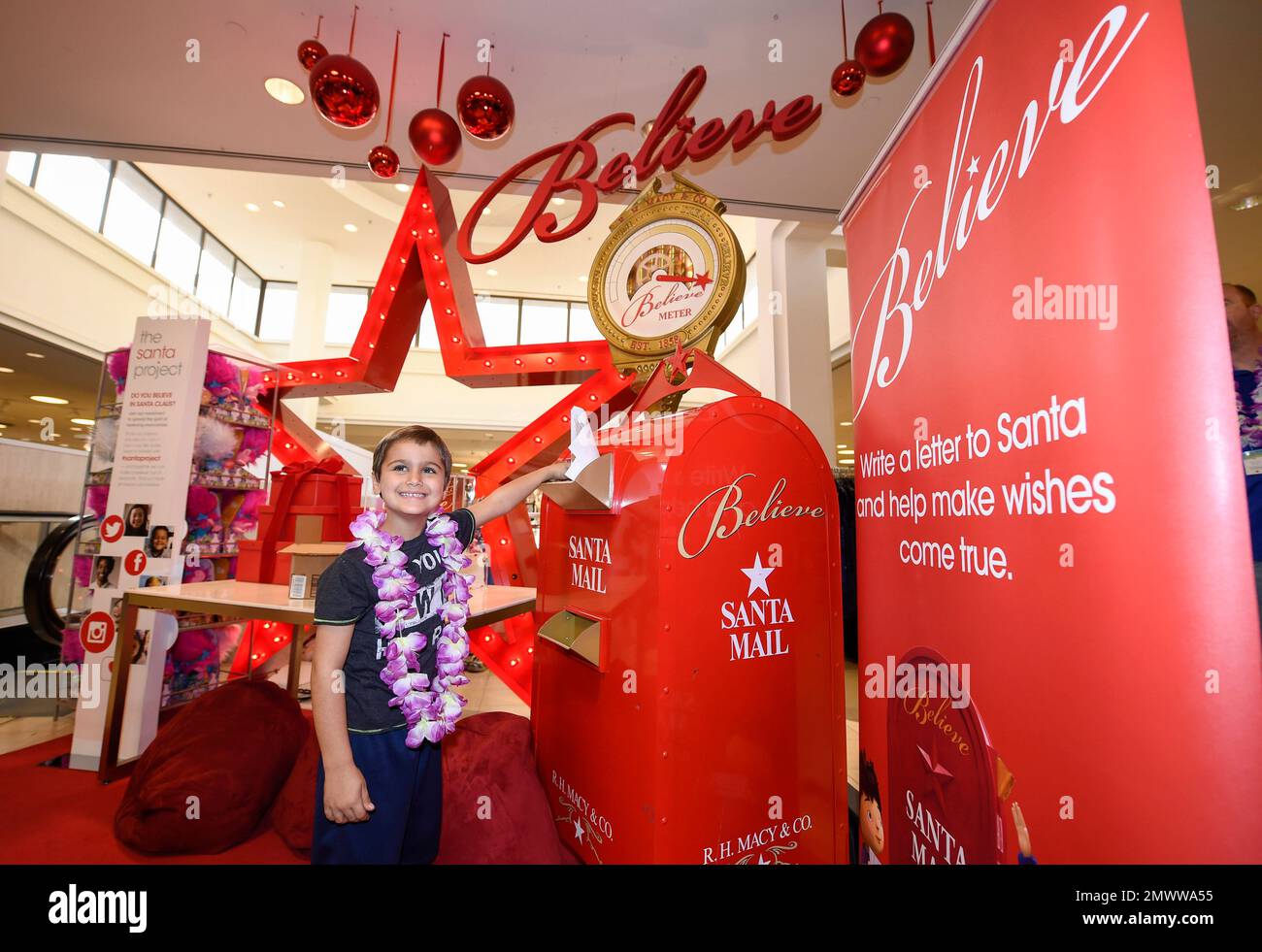 IMAGE DISTRIBUTED FOR MACY'S Myer, 6, puts a letter for Santa in a