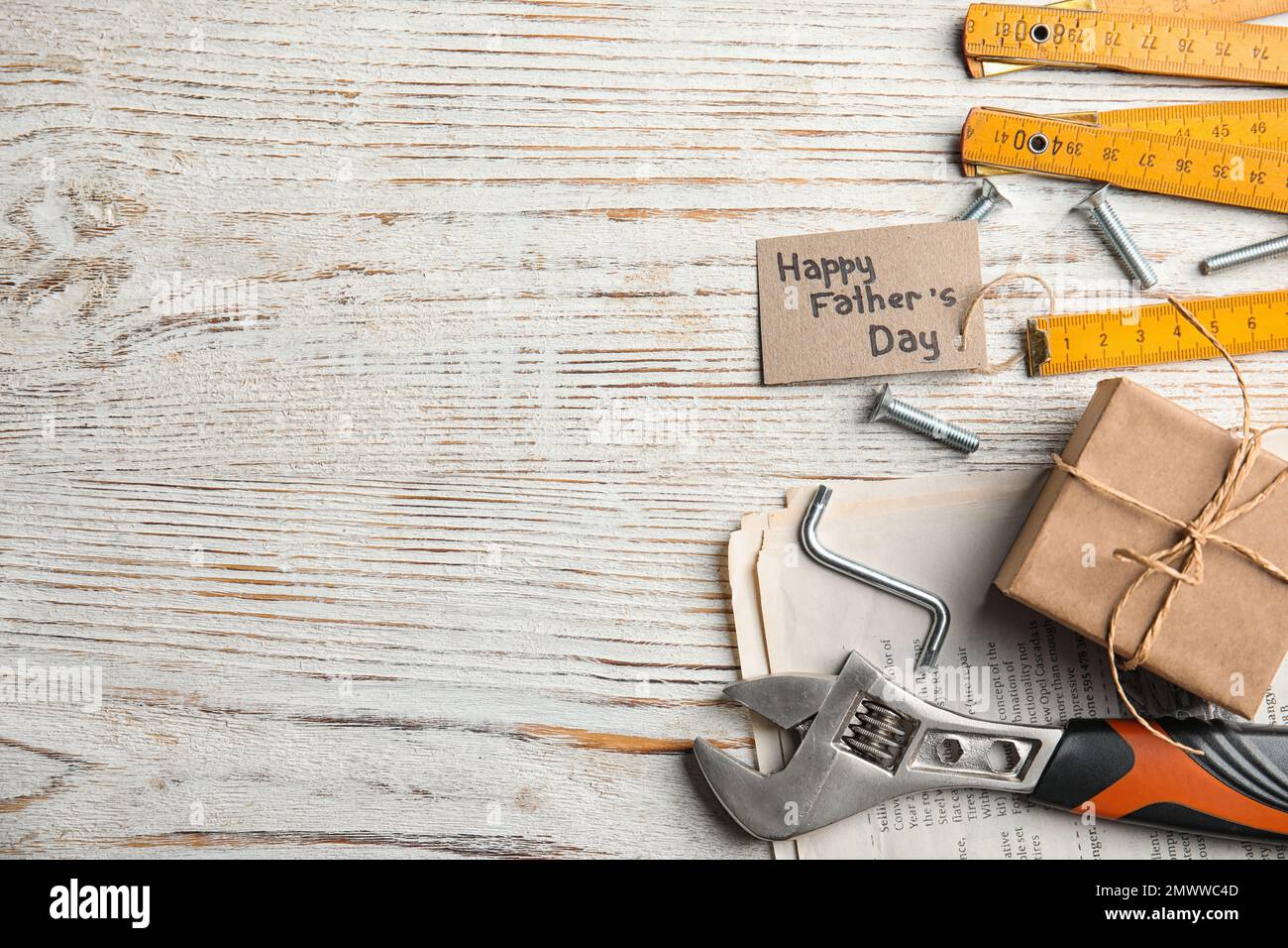 Flat lay composition with different tools on white wooden background ...
