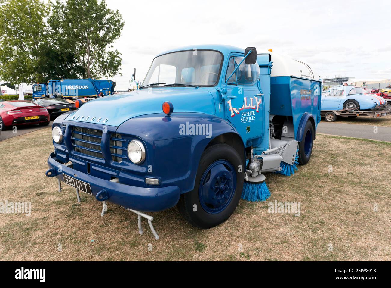 Three-quarters front view of a  Blue, 1961,Bedford Lacre road sweeper, on display at the 2022 Silverstone Classic Stock Photo
