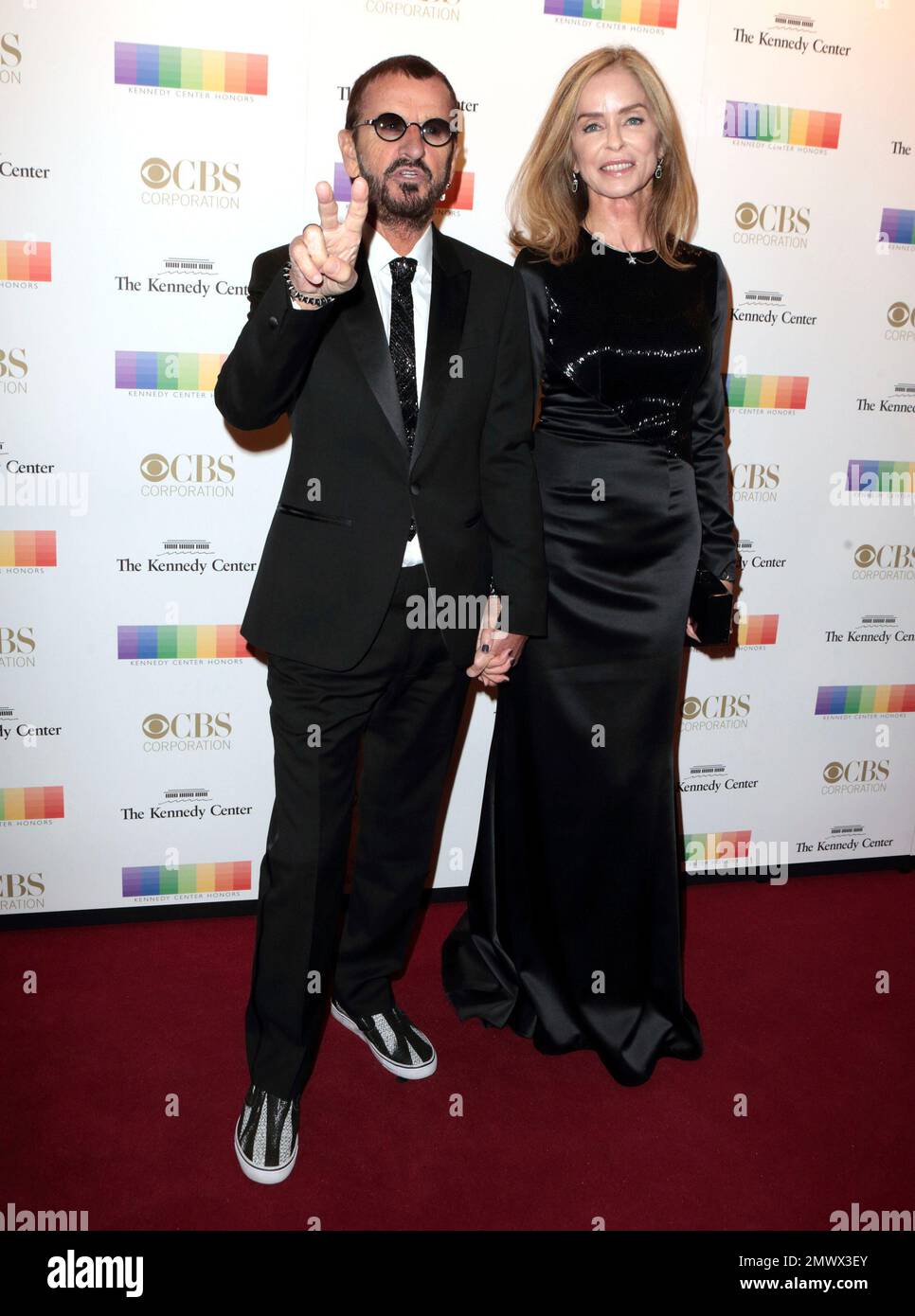 Ringo Starr of The Beatles, left, and his wife Barbara Bach attend the