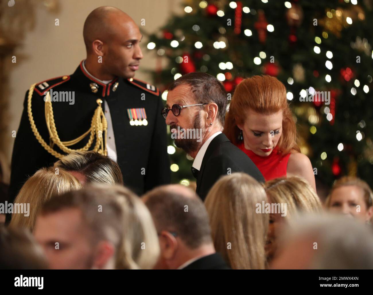 Beatles' Ringo Starr, center, arrives during a reception in honor of