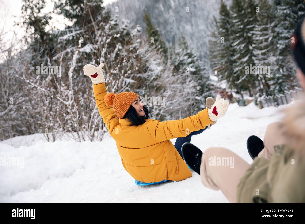 Snow Vaction Couple having fun and sledding on snow. Winter vacation Stock Photo - Alamy
