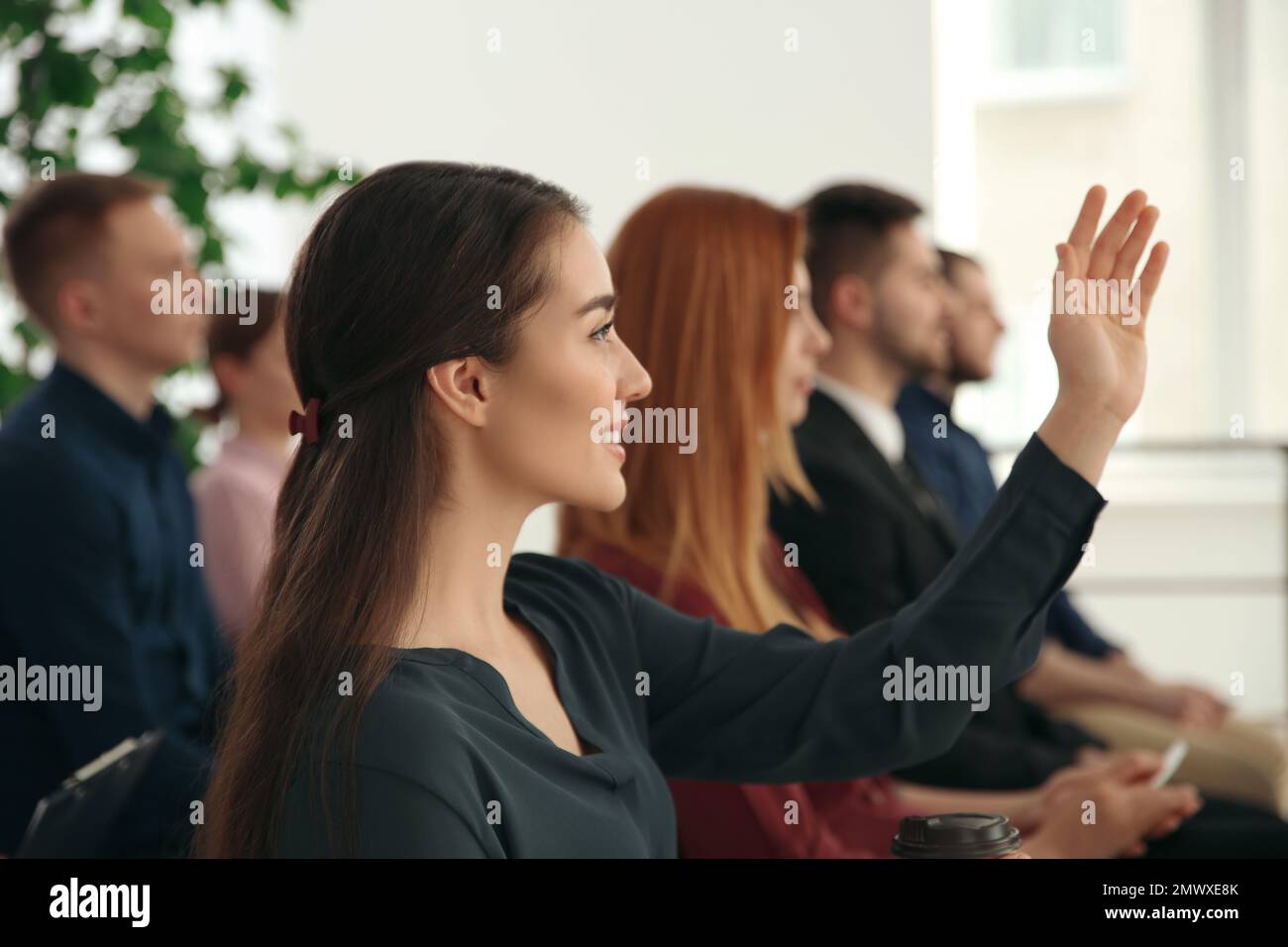 People Rasing Their Hand For Questions Young professional woman is raising her hand hi-res stock photography ...