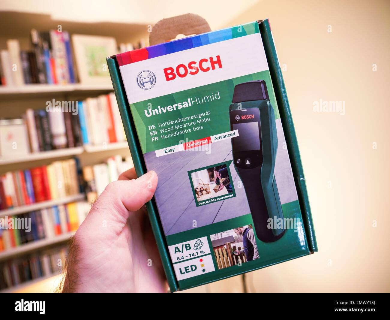 Paris, France Dec 2, 2022 POV male hand hodling package of new Bosch