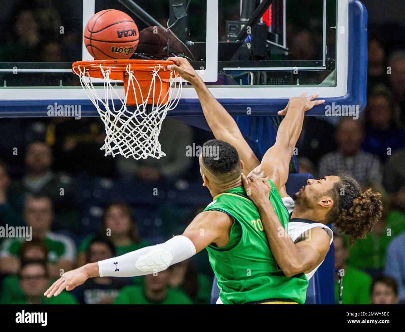 Iowa's Dom Uhl, right, competes with Notre Dame's Austin Torres (1) for