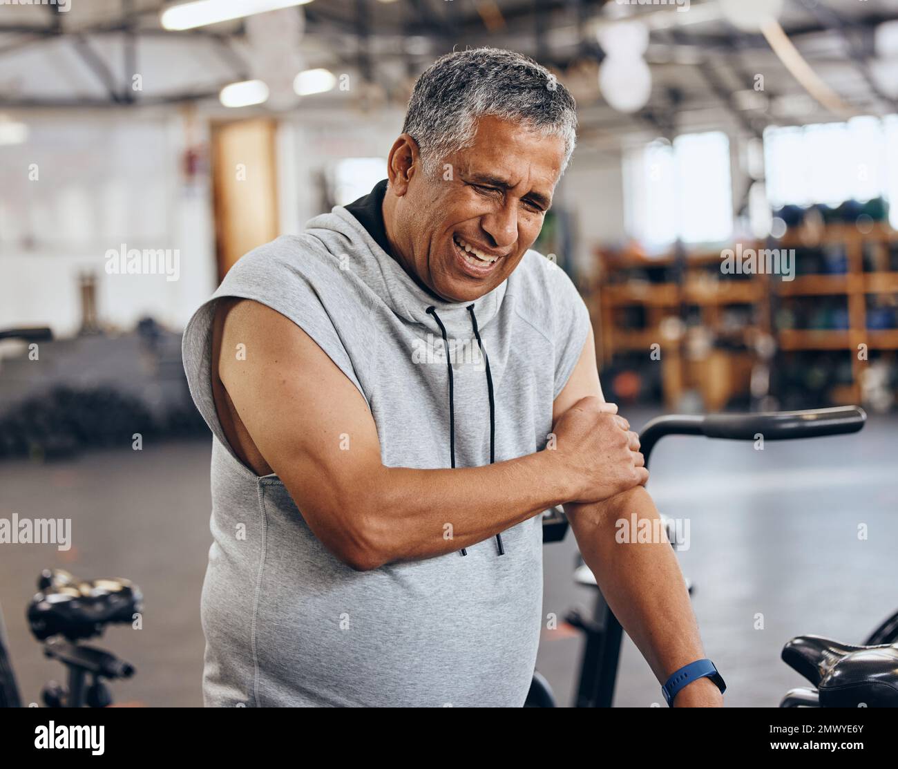 Sports, gym and injury, old man with arm pain, emergency during workout