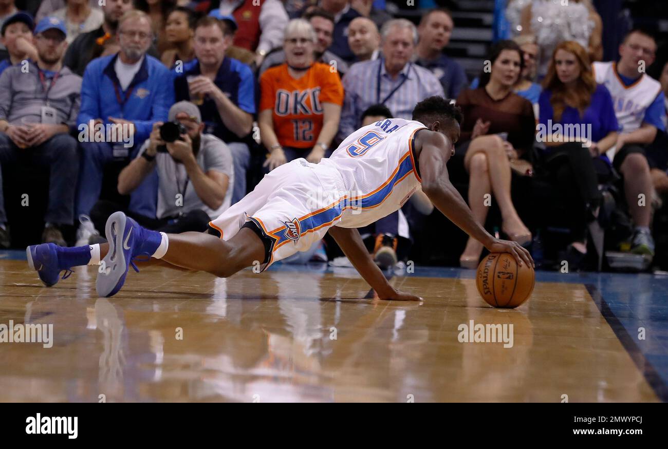 Oklahoma City Thunder forward Jerami Grant (9) saves the ball from