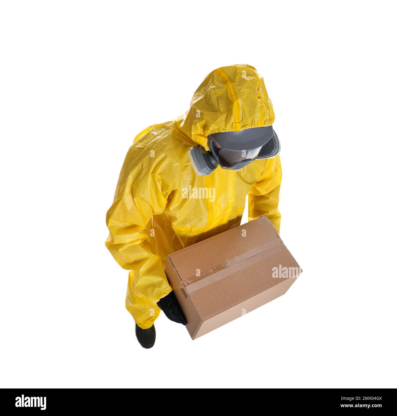 Man wearing chemical protective suit with cardboard box on white background, above view. Prevention of virus spread Stock Photo