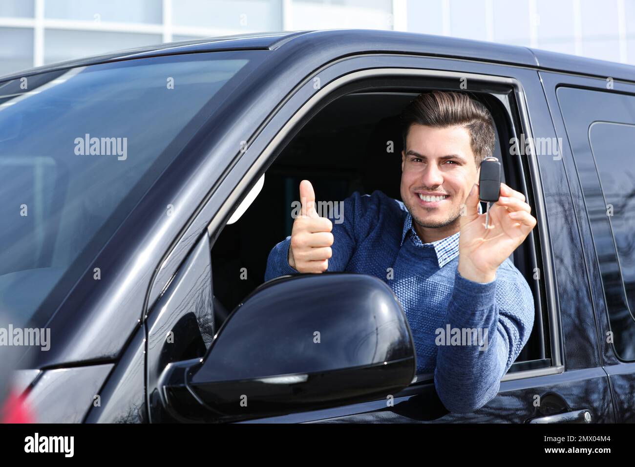 Man car key thumb up hi-res stock photography and images - Alamy
