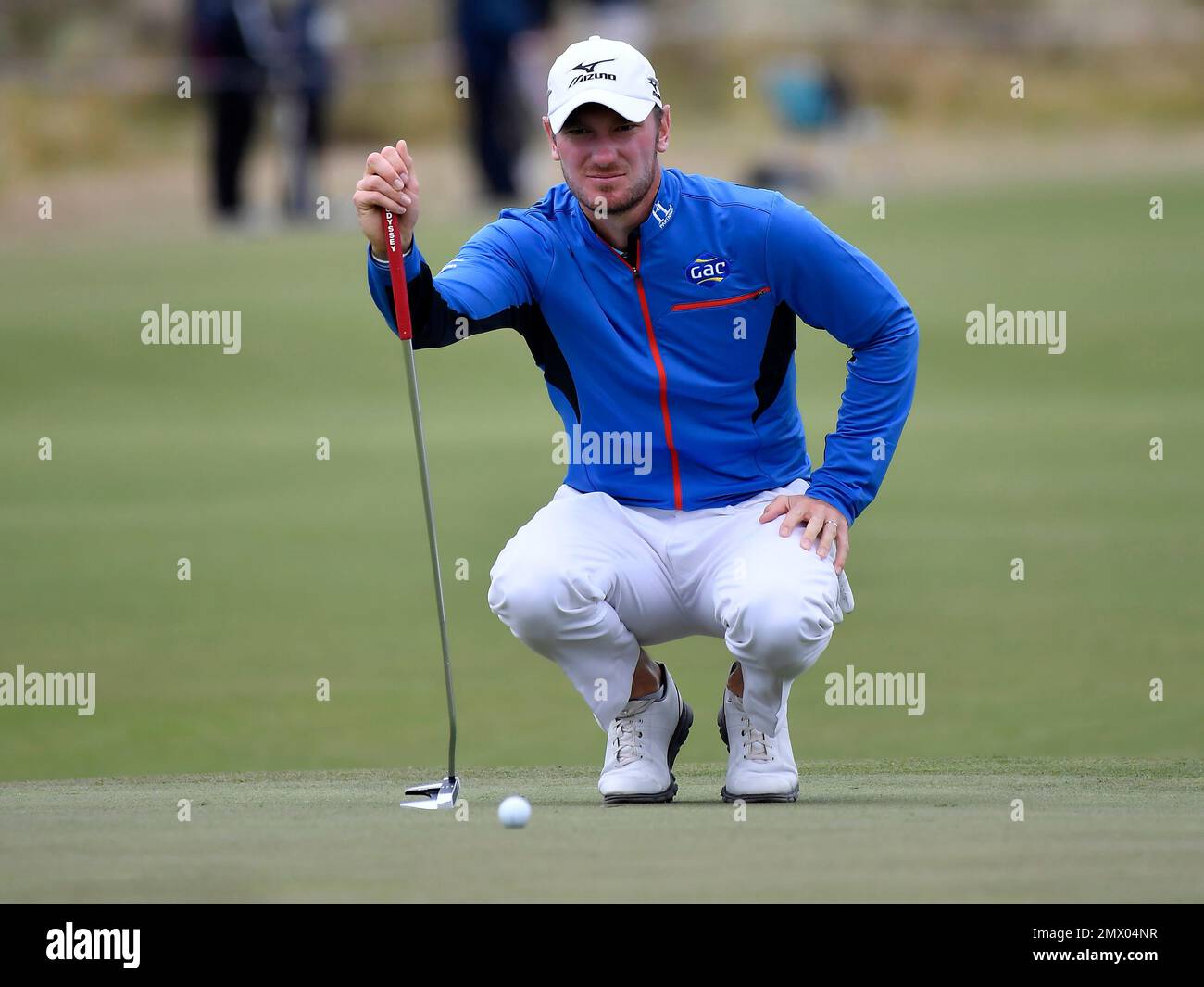 England's Chris Wood lines up his putt on the 18th green during his match  at the World Cup of Golf at Kingston Heath in Melbourne, Australia, Friday,  Nov. 25, 2016. (AP Photo/Andrew