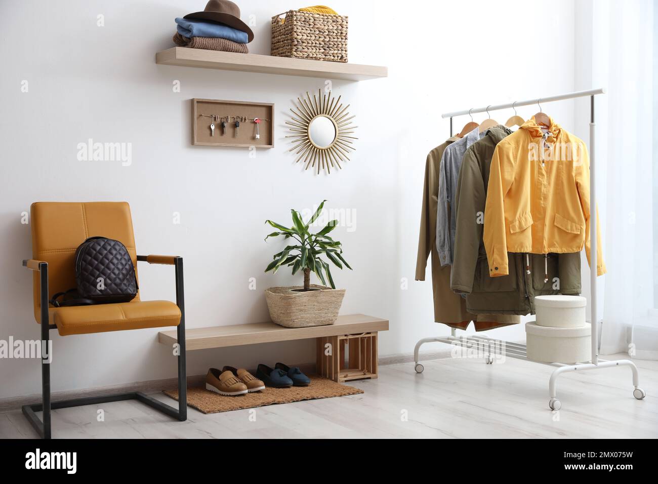Hallway interior with stylish furniture, clothes and accessories Stock ...