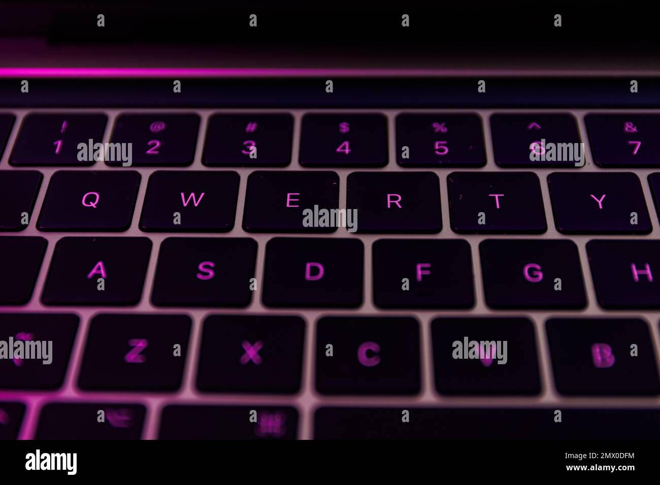 QWERTY keyboard close-up shot. QWERTY is a keyboard layout for Latin-script alphabets Stock Photo
