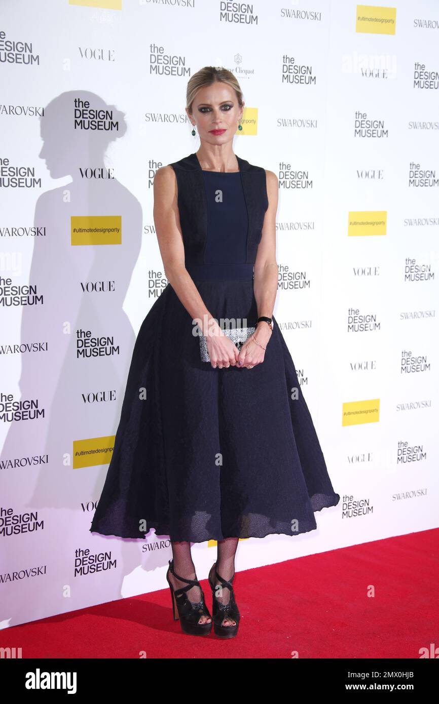 Laura Bailey poses for photographers upon arrival at the Design Museum