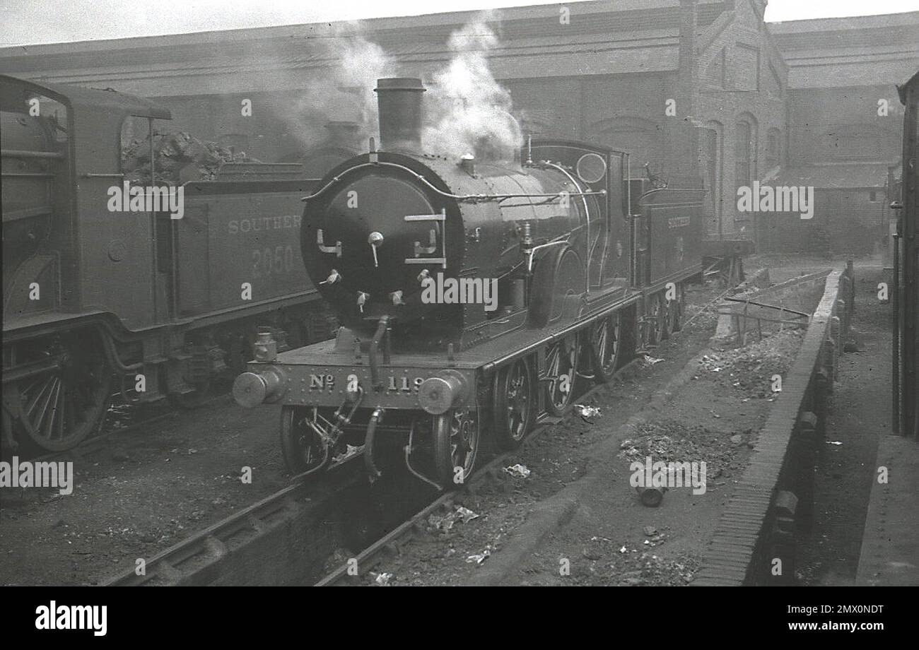 Former LSWR T9 Class 4-4-0 locomotive 30119 painted as LSWR 119 in Malachite Green livery for duties hauling the Royal Train. Behind is LBSCR B4 class 2050 which was withdrawn in 1950. Stock Photo