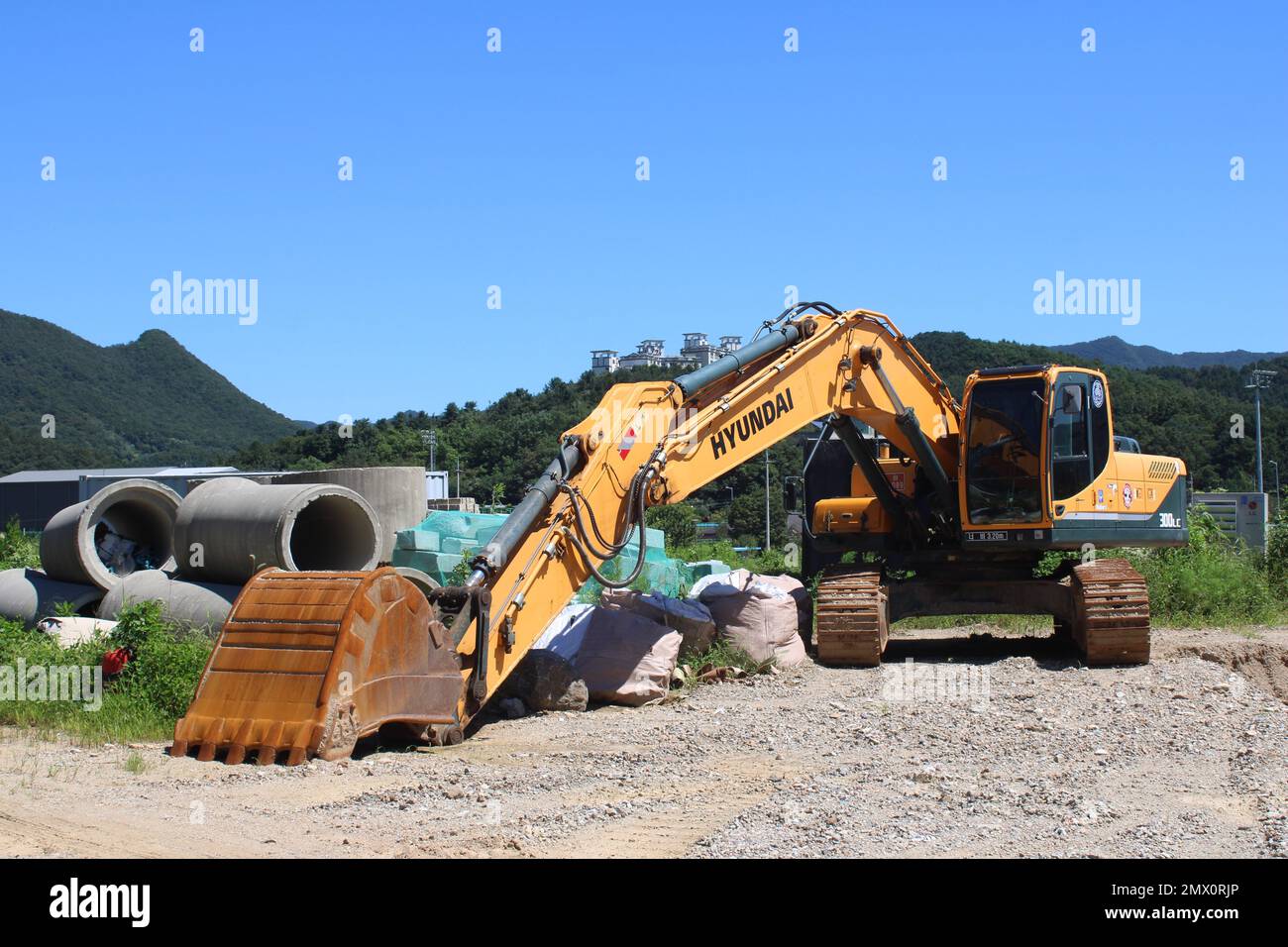 Hyundai excavator in rural construction site Stock Photo