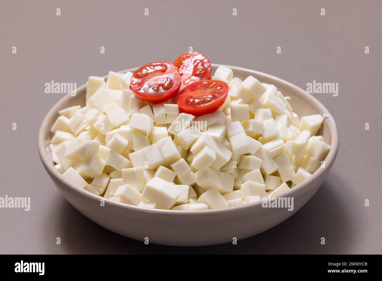 Italian cow mozzarella cheese cut into cubes for making pizza at home