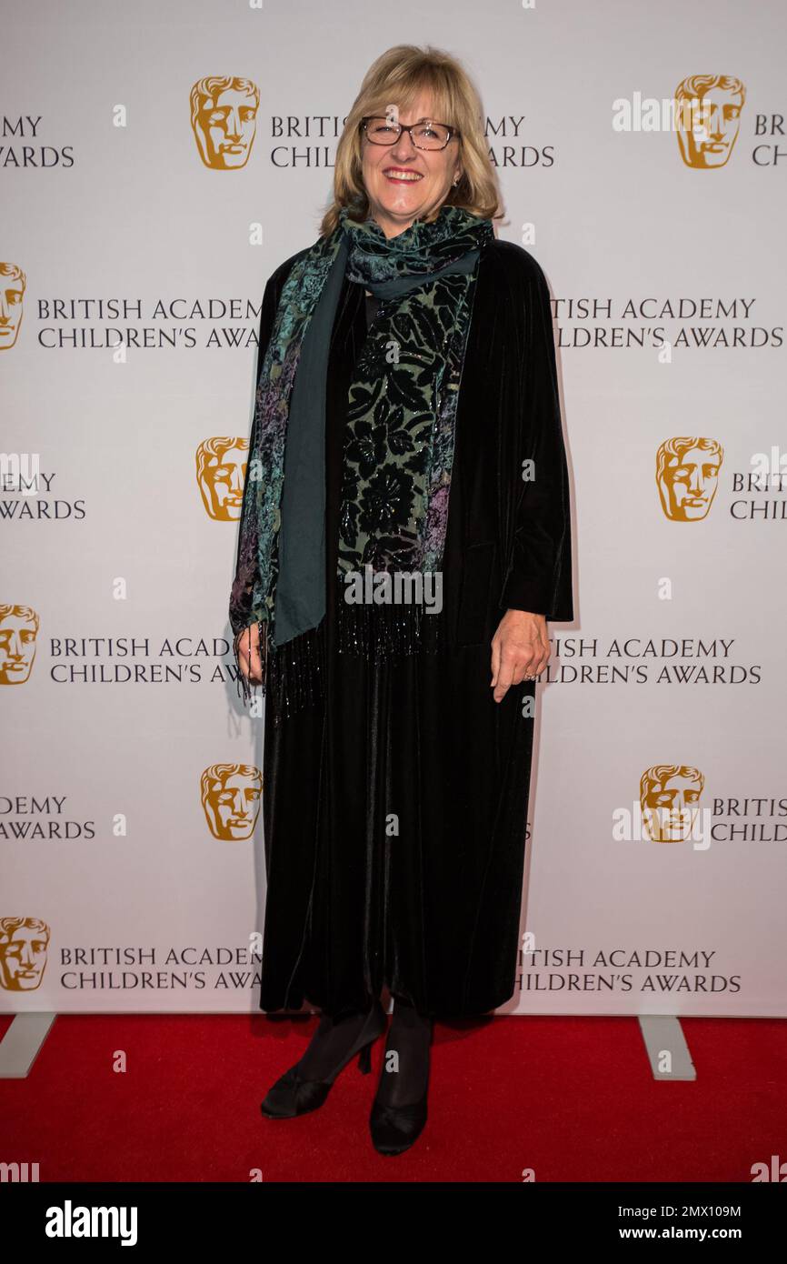 Healy poses for photographers upon arrival at the BAFTA Children