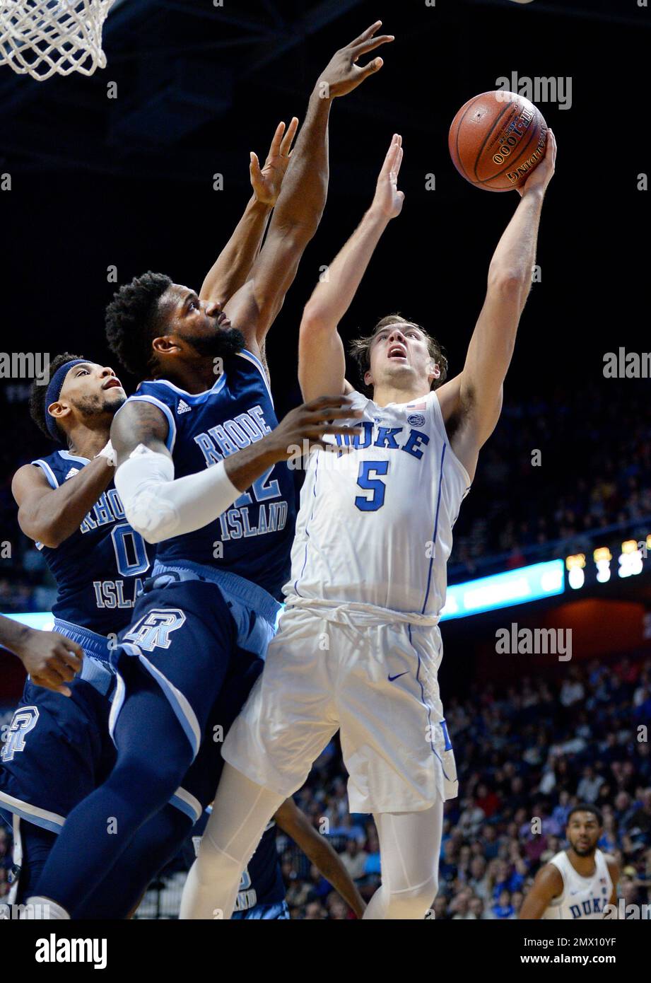 Duke's Luke Kennard, right, shoots as Rhode Island's E.C. Matthews